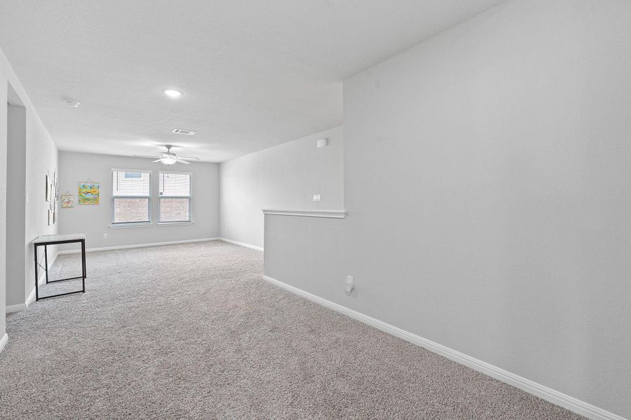 Carpeted empty room with baseboards, a ceiling fan, visible vents, and recessed lighting Carpeted empty room with baseboards, a ceiling fan, visible vents, and recessed lighting
