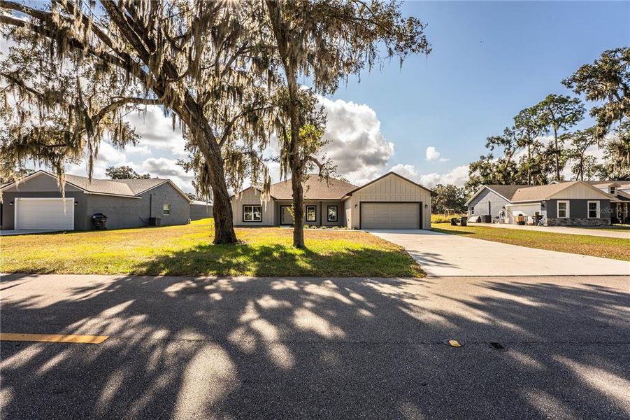 Front exterior of a new home in , Bartow, FL, highlighting curb appeal (Image 1).
