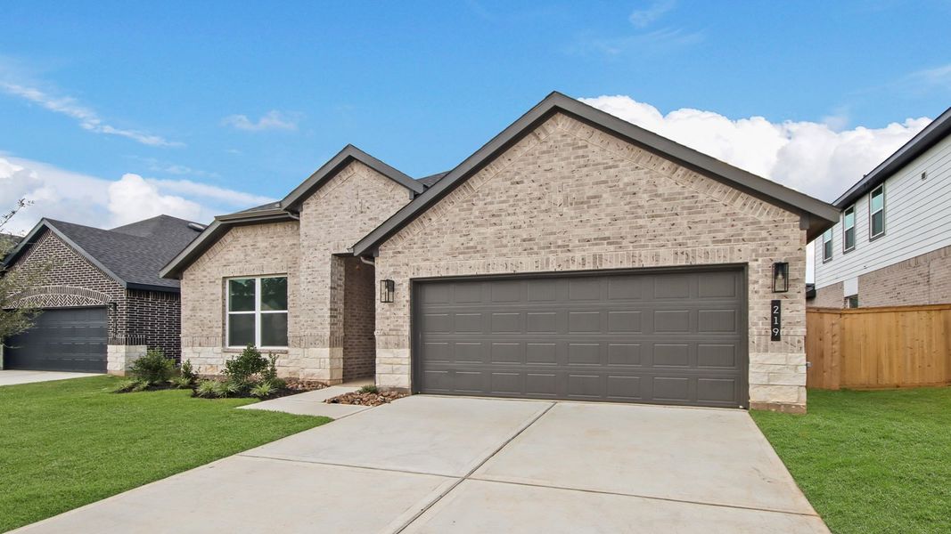 Front exterior of a new home in Hills of Westlake, Conroe, TX, highlighting curb appeal (Image 2).