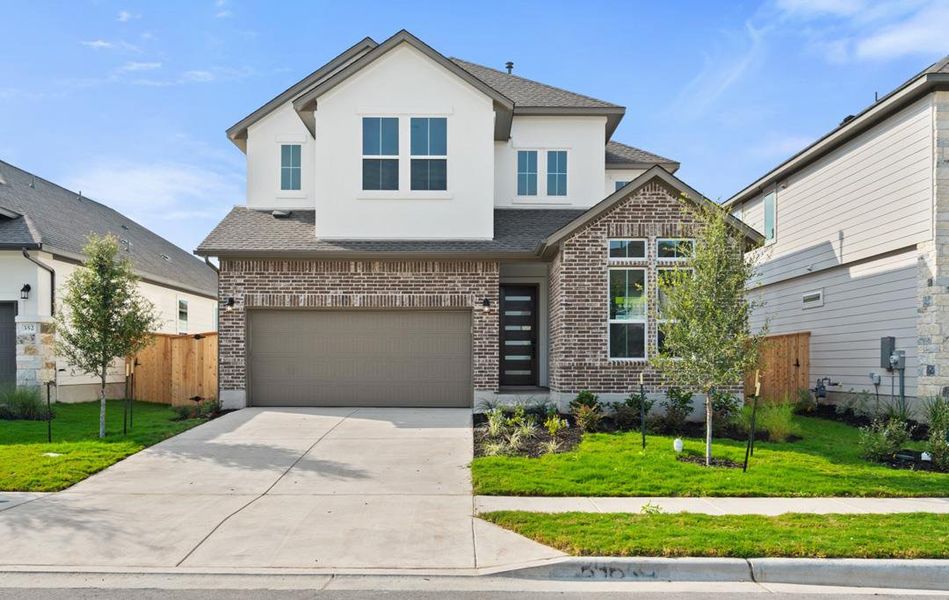 Front exterior of a new home in Arbor Collection At Park Central, Georgetown, TX, highlighting curb appeal (Image 22). Front exterior of a new home in Arbor Collection At Park Central, Georgetown, TX, highlighting curb appeal (Image 22).