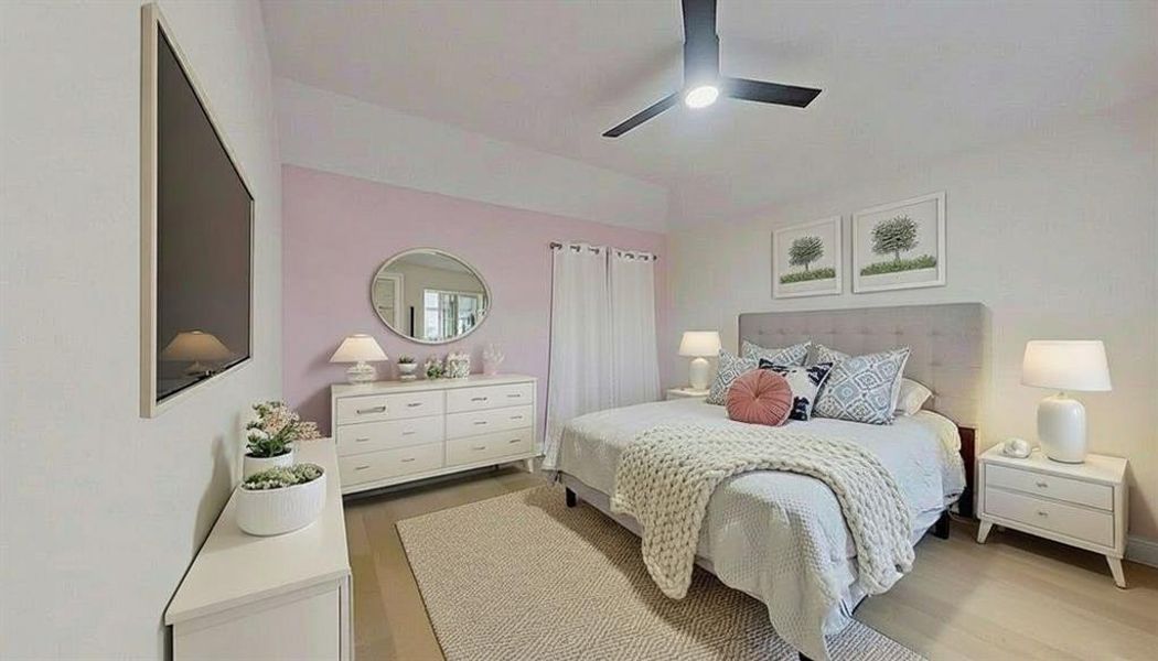 Bedroom with light wood-style flooring and ceiling fan