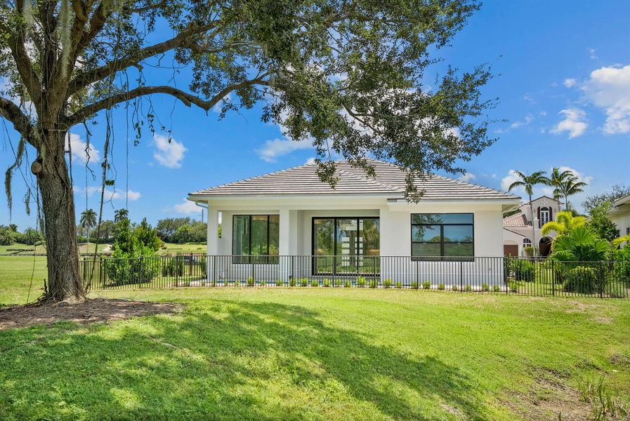 Front exterior of a new home in Tesoro Club, Port St. Lucie, FL, highlighting curb appeal (Image 2). Front exterior of a new home in Tesoro Club, Port St. Lucie, FL, highlighting curb appeal (Image 2).