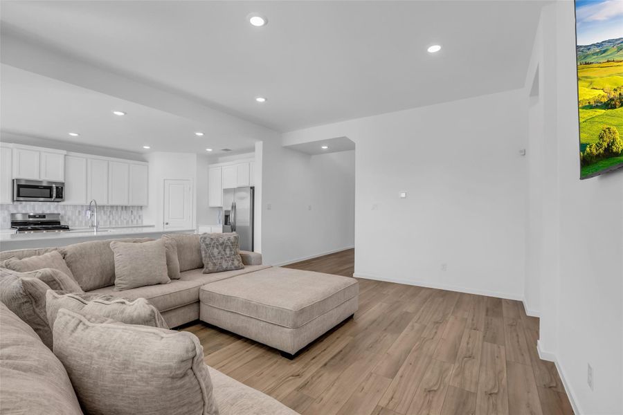 Main Living Area: Designed for flexibility and comfort, this expansive room easily accommodates multiple seating layouts while maintaining a strong connection to the kitchen and dining spaces. Clean sightlines, recessed lighting, and wide-plank flooring allow the scale of the room to speak for itself without feeling overwhelming. Main Living Area: Designed for flexibility and comfort, this expansive room easily accommodates multiple seating layouts while maintaining a strong connection to the kitchen and dining spaces. Clean sightlines, recessed lighting, and wide-plank flooring allow the scale of the room to speak for itself without feeling overwhelming.