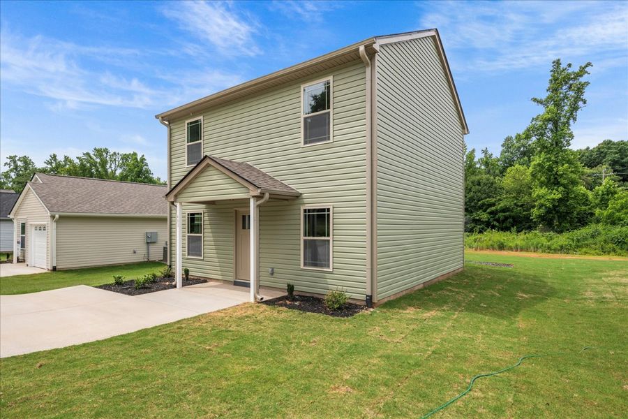 Representative exterior photo of a completed home built from the Branson by Enchanted Homes in Gentry Place, Spartanburg, SC (Image 14).
