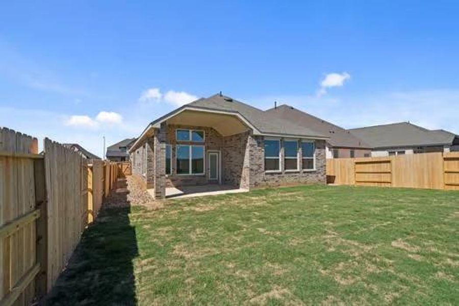 Exterior details and patio area of a home in Wildrye, Waller (Image 4).