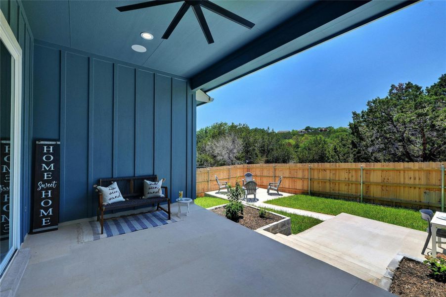 Covered patio with a dark blue board-and-batten accent wall