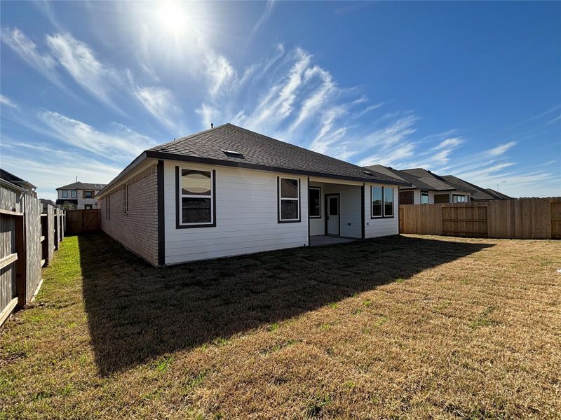 Exterior details and patio area of a home in Sunterra, Katy (Image 3).