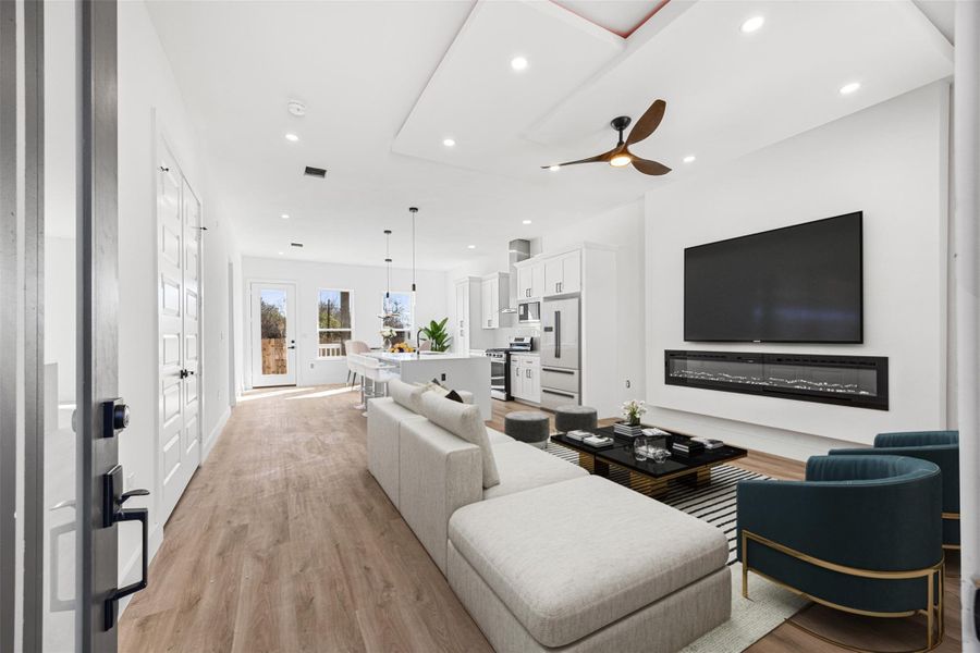 Entry way, with living room virtually staged.