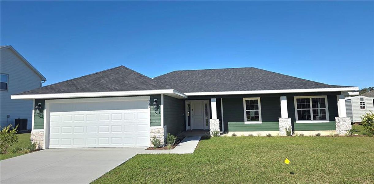 Front exterior of a new home in The Preserve at Laurel Lake, Lake City, FL, highlighting curb appeal (Image 2).