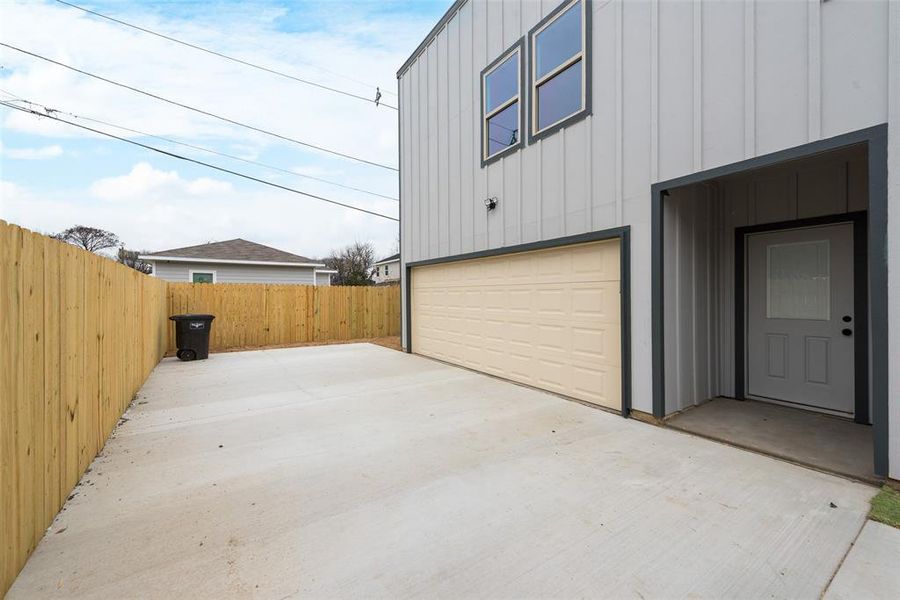 Garage featuring fence