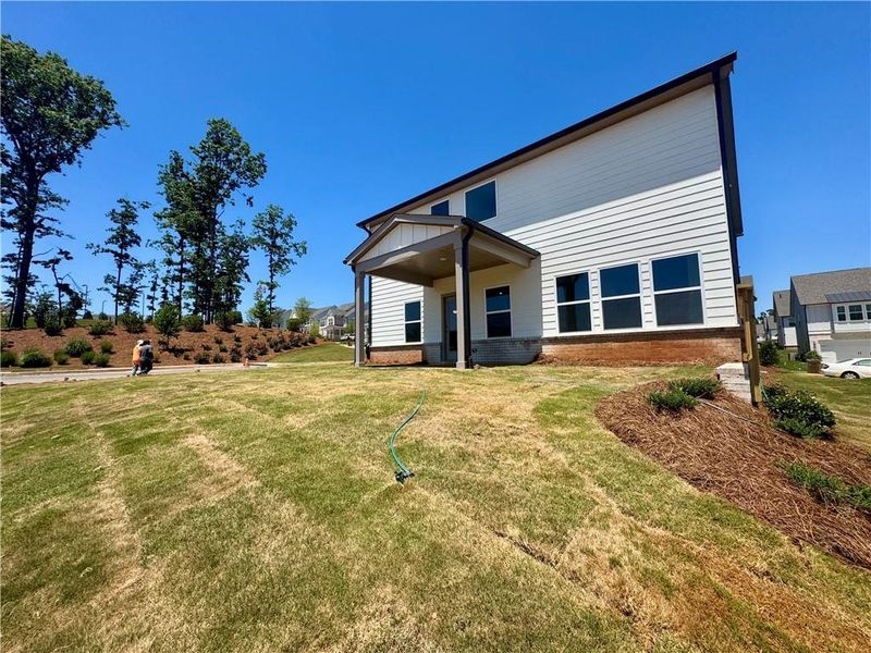 Exterior details and patio area of a home in Eastlyn Crossing, Flowery Branch (Image 17).