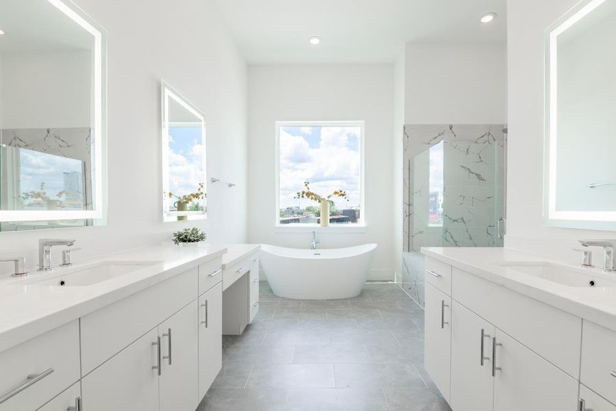 Primary bath is heaven with wrap around windows on the corner, floating tub and separate vanities. Similar plan and finishes. Primary bath is heaven with wrap around windows on the corner, floating tub and separate vanities. Similar plan and finishes.