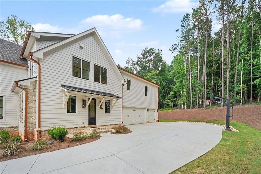 Front exterior of a new home in , Monroe, GA, highlighting curb appeal (Image 29). Front exterior of a new home in , Monroe, GA, highlighting curb appeal (Image 29).