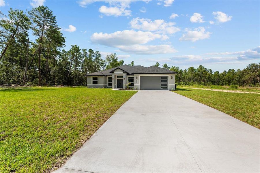 Front exterior of a new home in , Ocala, FL, highlighting curb appeal (Image 23). Front exterior of a new home in , Ocala, FL, highlighting curb appeal (Image 23).