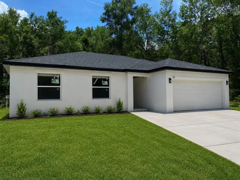 Front exterior of a new home in , Ocala, FL, highlighting curb appeal (Image 2). Front exterior of a new home in , Ocala, FL, highlighting curb appeal (Image 2).