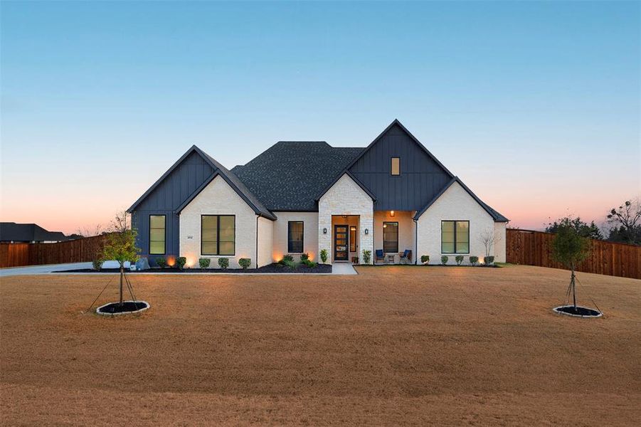Front exterior of a new home in The Arbors Midlothian, Midlothian, TX, highlighting curb appeal (Image 1). Front exterior of a new home in The Arbors Midlothian, Midlothian, TX, highlighting curb appeal (Image 1).