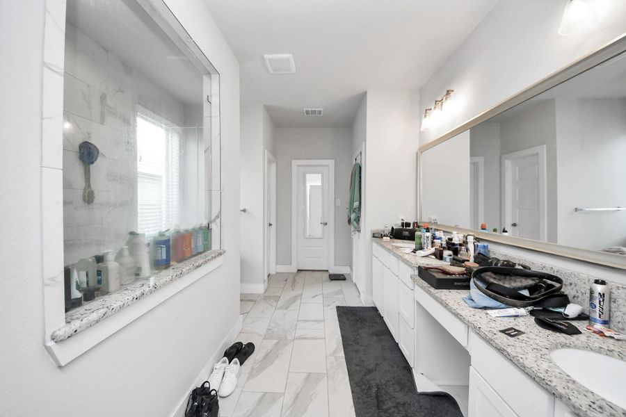 Furnished interior view inside a new home in Sunterra, Katy (Image 13). Furnished interior view inside a new home in Sunterra, Katy (Image 13).