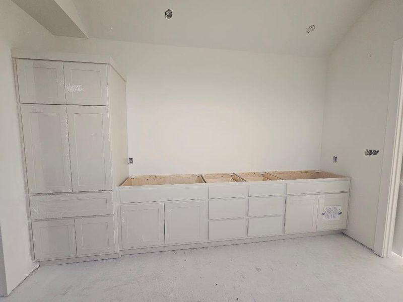 Mudroom featuring concrete flooring Mudroom featuring concrete flooring