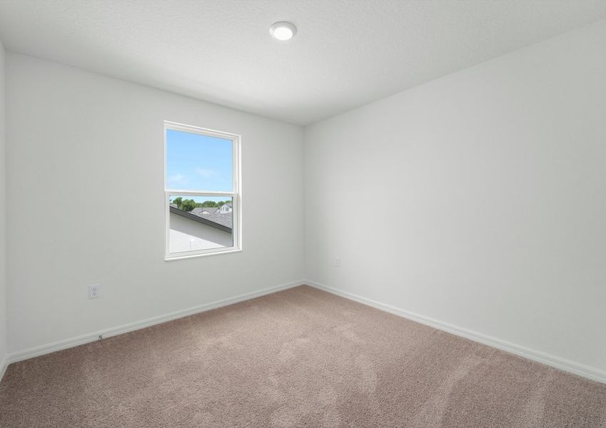 Lush carpet is featured in each bedroom