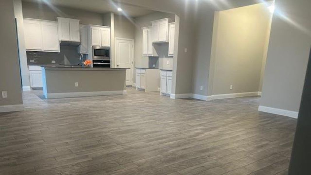 Kitchen opens to both Dining and Living