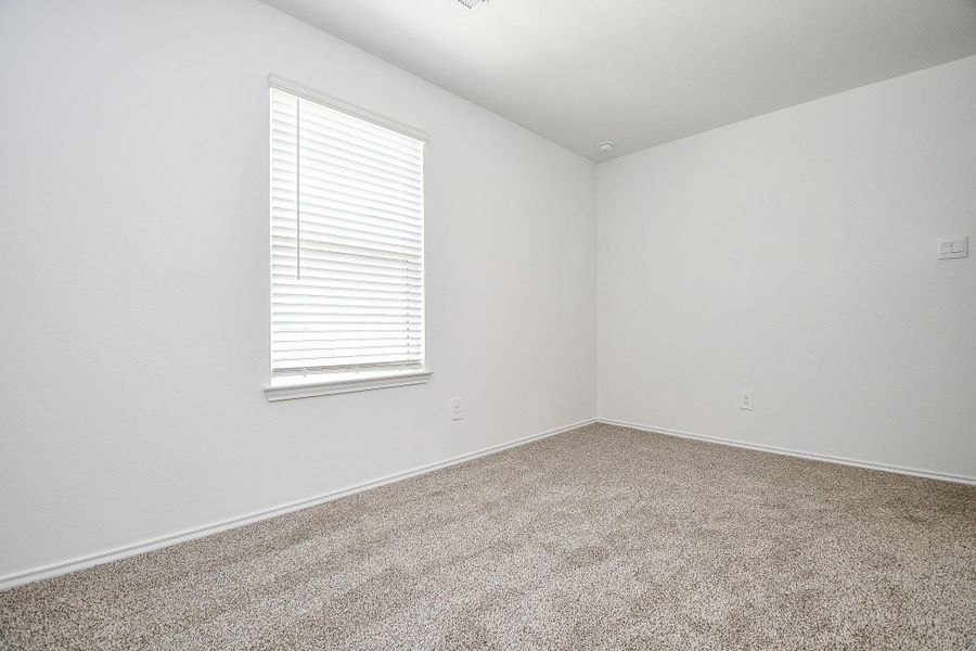 This room features clean white walls and soft carpet flooring, complemented by a window with blinds for natural light. It's a simple and inviting space, ideal for a bedroom or office. This room features clean white walls and soft carpet flooring, complemented by a window with blinds for natural light. It's a simple and inviting space, ideal for a bedroom or office.