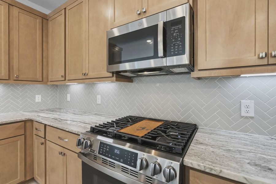 Representative furnished interior of a home built from the Carriagehouse by Chesmar Homes in Meridiana Townhomes, Iowa Colony (Image 13).
