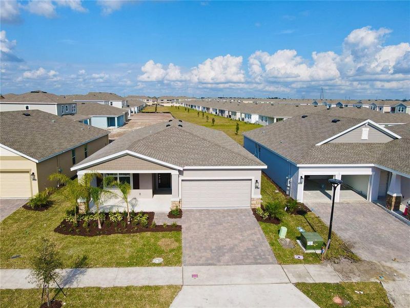 Front exterior of a new home in Tohoqua, Kissimmee, FL, highlighting curb appeal (Image 2). Front exterior of a new home in Tohoqua, Kissimmee, FL, highlighting curb appeal (Image 2).