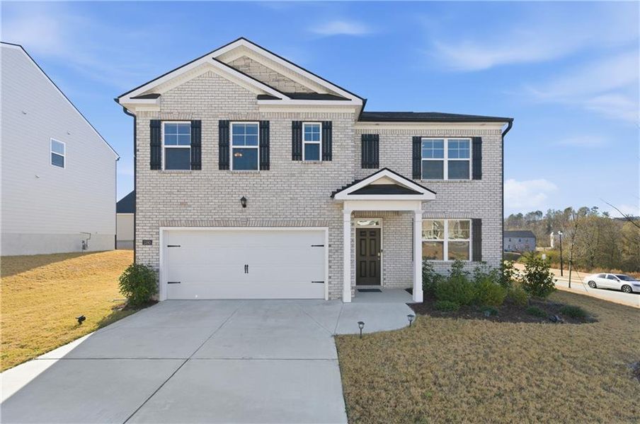 Front exterior of a new home in Brooks Village, Dacula, GA, highlighting curb appeal (Image 29).