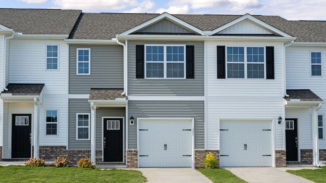Front exterior of a new home in The Townes at Prestleigh, Wake Forest, NC, highlighting curb appeal (Image 1). Front exterior of a new home in The Townes at Prestleigh, Wake Forest, NC, highlighting curb appeal (Image 1).