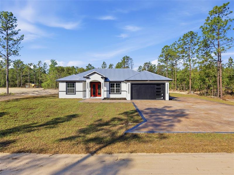 Front exterior of a new home in , Ocala, FL, highlighting curb appeal (Image 27).