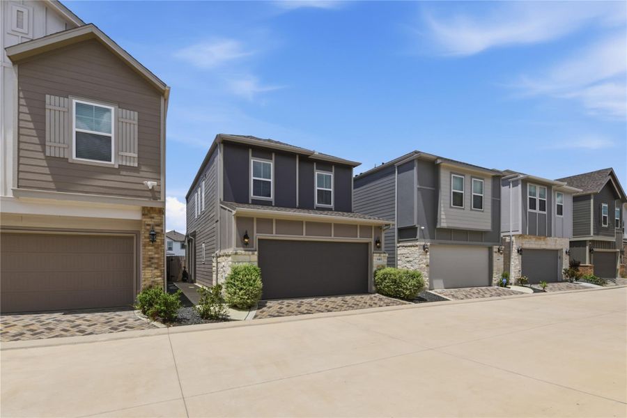 Front exterior of a new home in Dunvale Village - Townhome Collection, Houston, TX, highlighting curb appeal (Image 21).