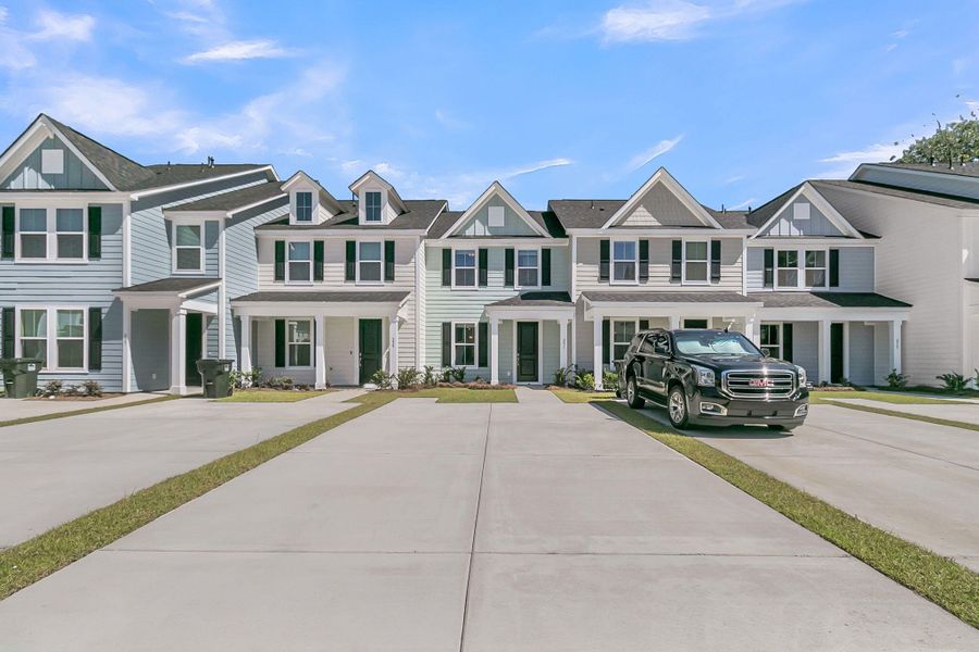 Front exterior of a new home in Abbey Walk, Moncks Corner, SC, highlighting curb appeal (Image 1).