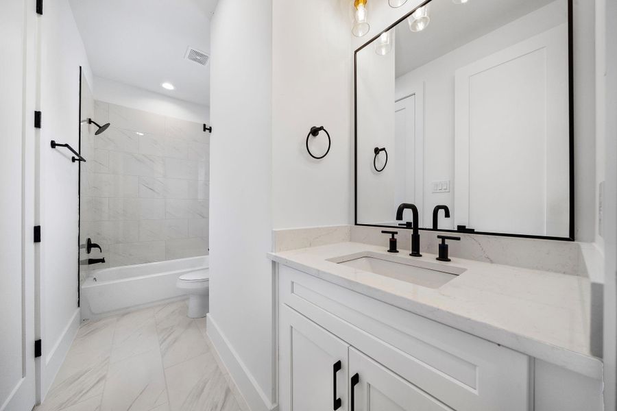 Photo of the third-floor guest bath. (Photos are of a previously completed home. Finishes are subject to change.) Photo of the third-floor guest bath. (Photos are of a previously completed home. Finishes are subject to change.)