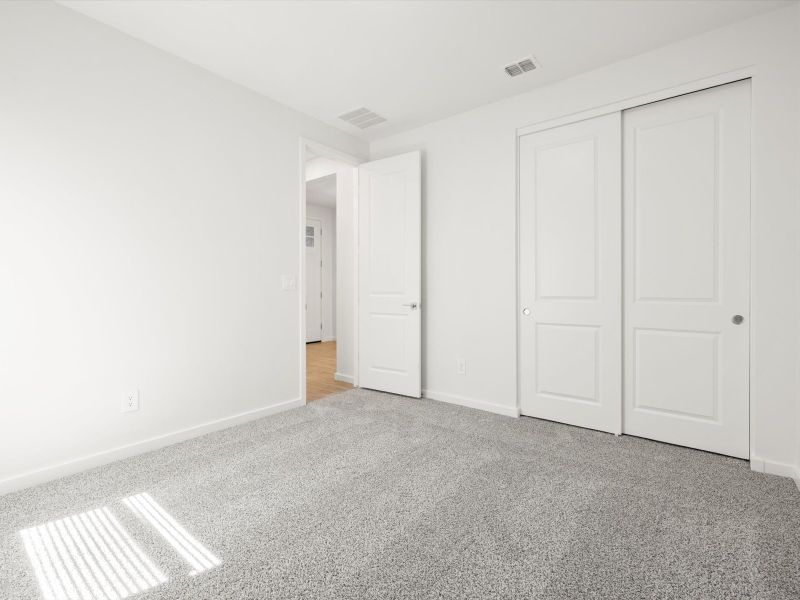 Spacious, unfurnished interior of a new home in Blossom Rock Reserve Series, Apache Junction (Image 10).
