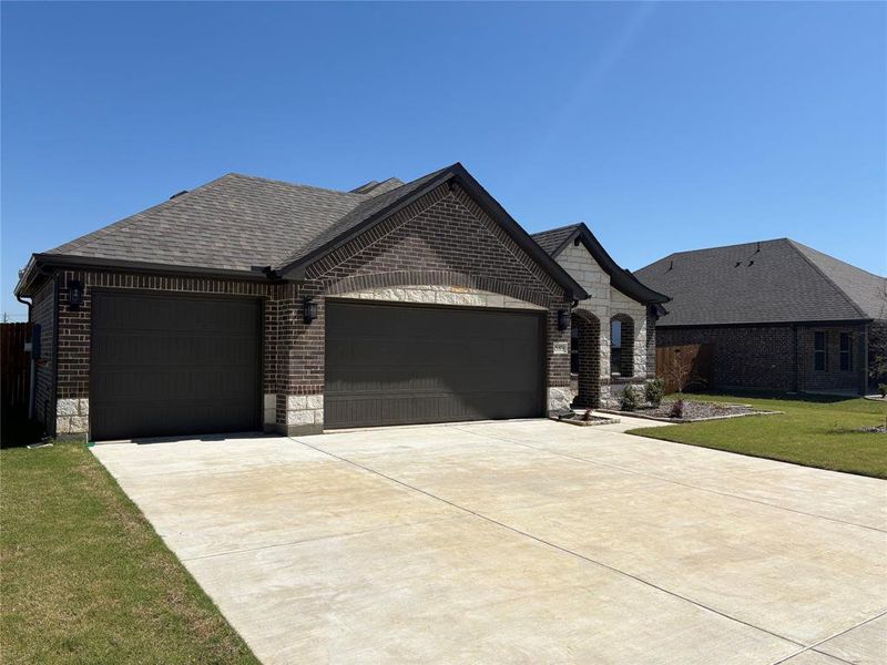 Front exterior of a new home in , Pilot Point, TX, highlighting curb appeal (Image 2). Front exterior of a new home in , Pilot Point, TX, highlighting curb appeal (Image 2).