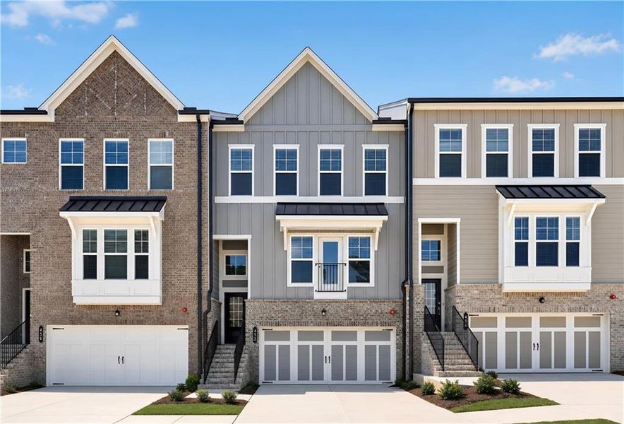 Front exterior of a new home in Forrest Crossing, Woodstock, GA, highlighting curb appeal (Image 2). Front exterior of a new home in Forrest Crossing, Woodstock, GA, highlighting curb appeal (Image 2).