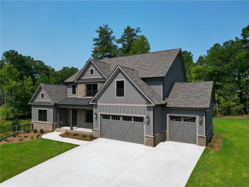 Front exterior of a new home in Spring Creek, Monroe, GA, highlighting curb appeal (Image 2). Front exterior of a new home in Spring Creek, Monroe, GA, highlighting curb appeal (Image 2).