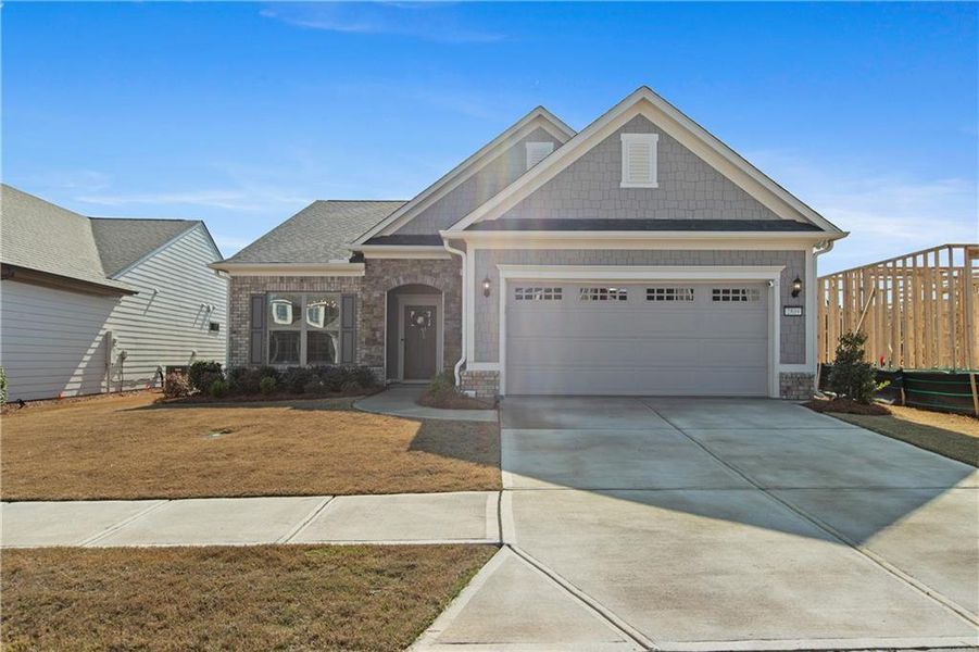 Front exterior of a new home in , Hoschton, GA, highlighting curb appeal (Image 2). Front exterior of a new home in , Hoschton, GA, highlighting curb appeal (Image 2).