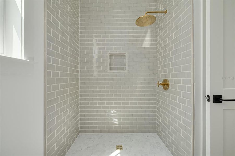 The first-floor bathroom includes a stand-up shower.