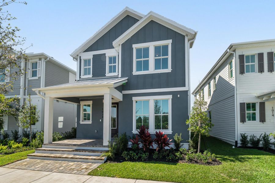 Front exterior of a new home in Newfield - Rosette Park, Palm City, FL, highlighting curb appeal (Image 13).