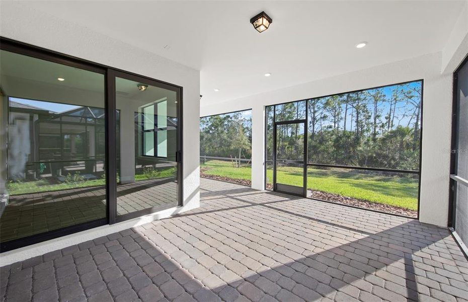 Exterior details and patio area of a home in Cedar Grove at The Woodlands, North Port (Image 4).