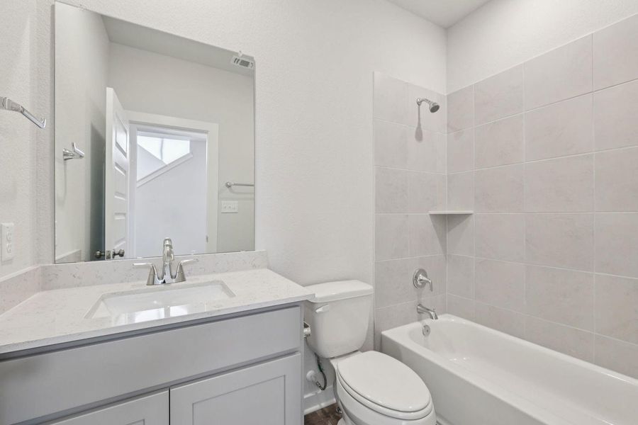 Furnished interior view inside a new home in The Hollows at Avery Centre, Round Rock (Image 13).