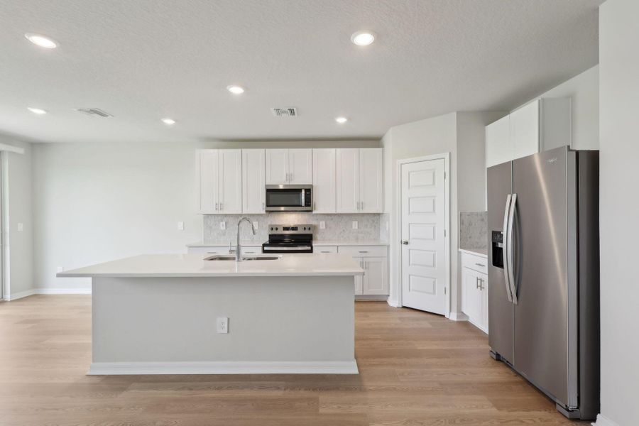 Furnished interior view inside a new home in Hampton Park - Classic Series, Vero Beach (Image 13).