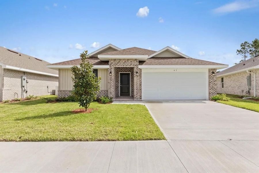 Representative exterior photo of a completed home built from the 1512 by Adams Homes in Winding Oaks, Weeki Wachee, FL (Image 24).