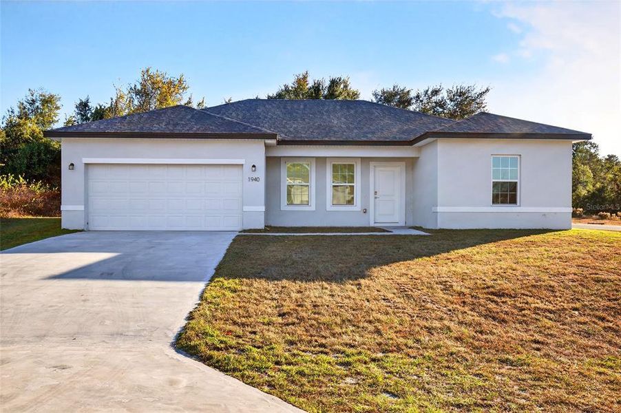 Front exterior of a new home in , Ocala, FL, highlighting curb appeal (Image 2). Front exterior of a new home in , Ocala, FL, highlighting curb appeal (Image 2).