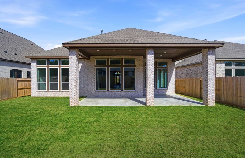 Exterior details and patio area of a home in The Highlands 55′, Porter (Image 25).