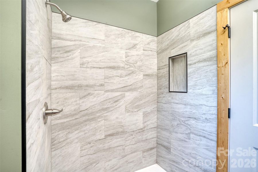 Walk in tile shower in primary Walk in tile shower in primary