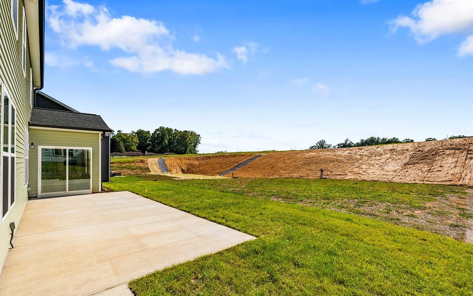Front exterior of a new home in Brooke Hill, Lewisville, NC, highlighting curb appeal (Image 26).