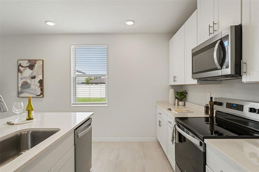 Furnished interior view inside a new home in Two Rivers - Classic Series, Zephyrhills (Image 5).