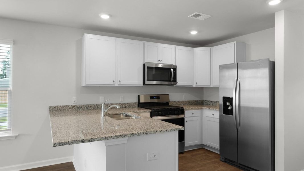 Furnished interior view inside a new home in Pine Hills Townhomes at Cane Bay, Summerville (Image 5).